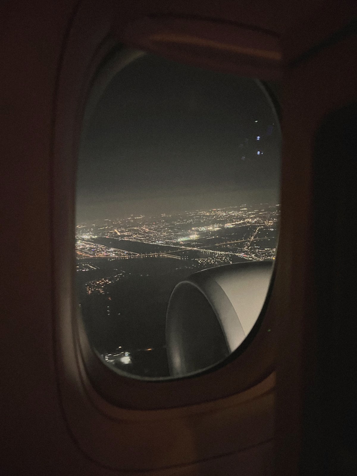 City lights seen from a plane window at night