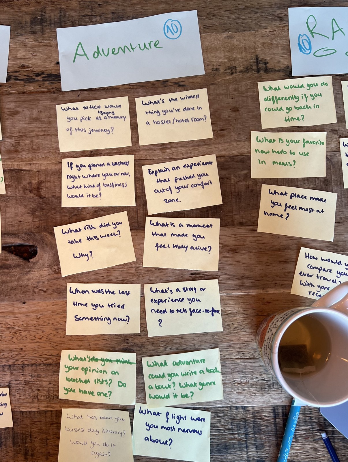 Close-up of handwritten Adventure category question notes on a wooden table